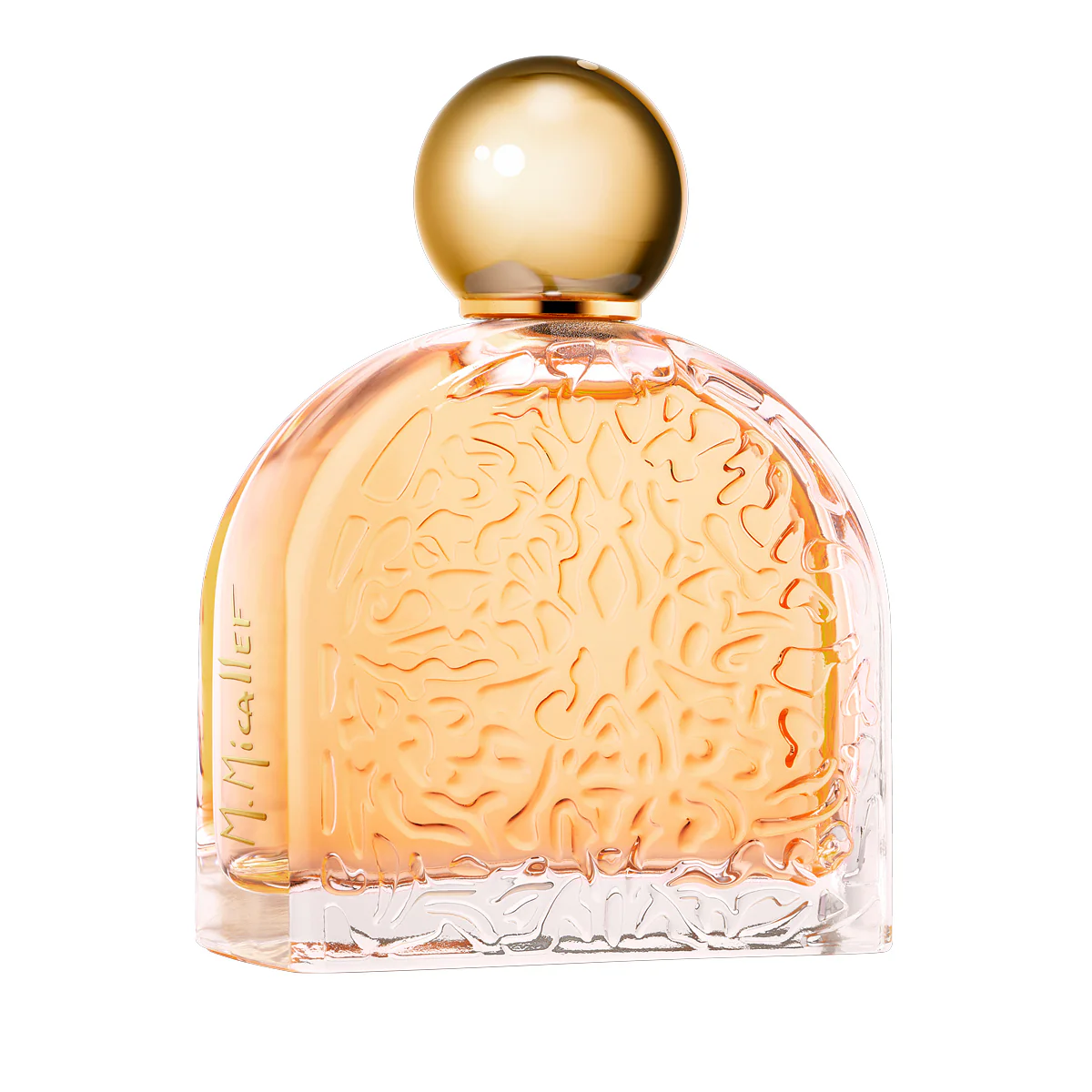 Perfume bottle with peach liquid and a brain-like embossed design inside, rounded gold cap on top