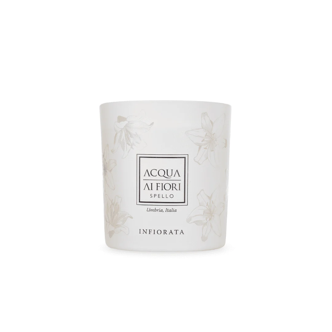 White scented candle in a cylindrical jar with floral designs and a central label reading 'ACQUA AI FIORI' and 'INFIORATA'