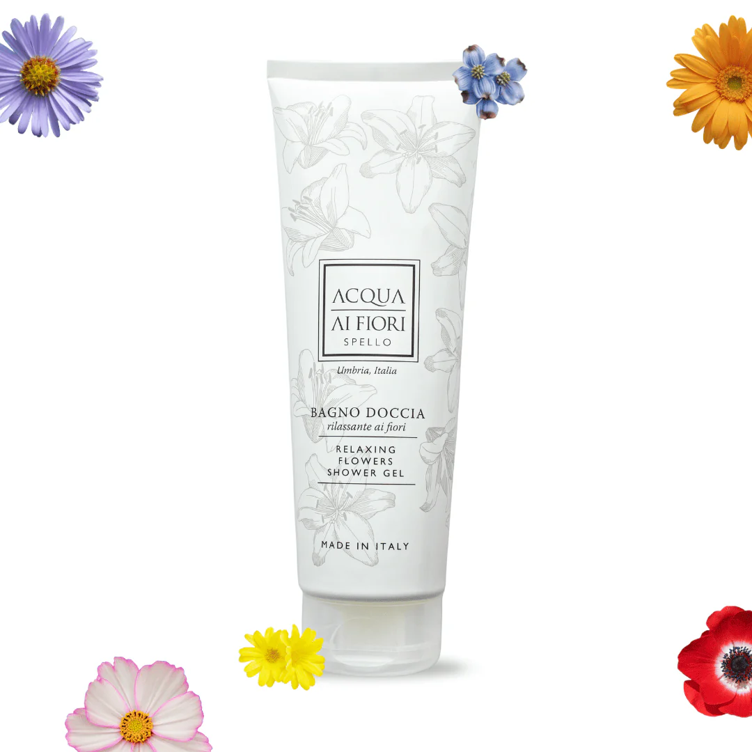 White tube of Acqua ai Fiori Relaxing Flowers Shower Gel with a floral line drawing, centered on a white background, surrounded by colorful flowers (purple, yellow, red) for a fresh, floral look.