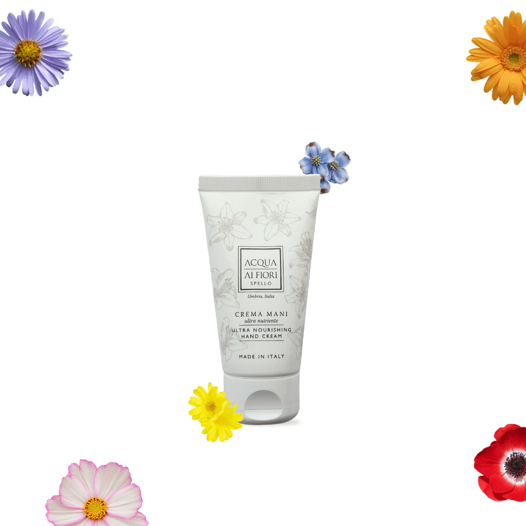 Tube of Acqua Ai Fiori hand cream with floral pattern, surrounded by colorful flowers on white background (Made in Italy).
