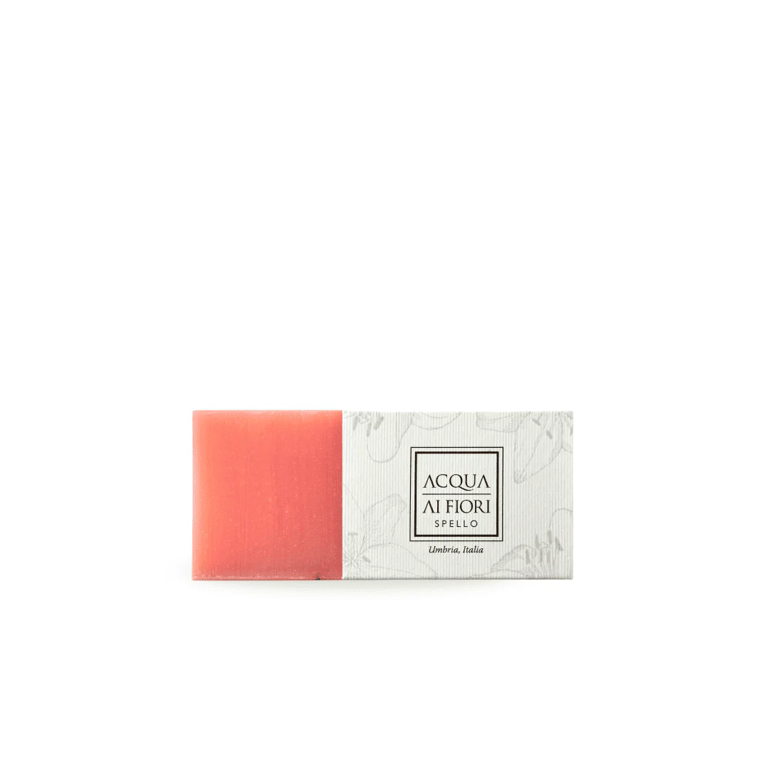 Pink rectangular bar soap beside white decorative box with Acqua Ai Fiori logo and Umbria, Italia text (product image).