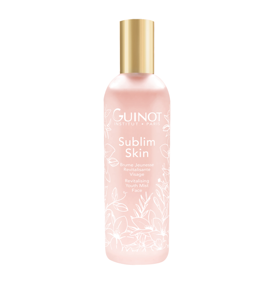Pink bottle of Guinot Sublim Skin Revitalizing Youth Mist for face with a gold cap.