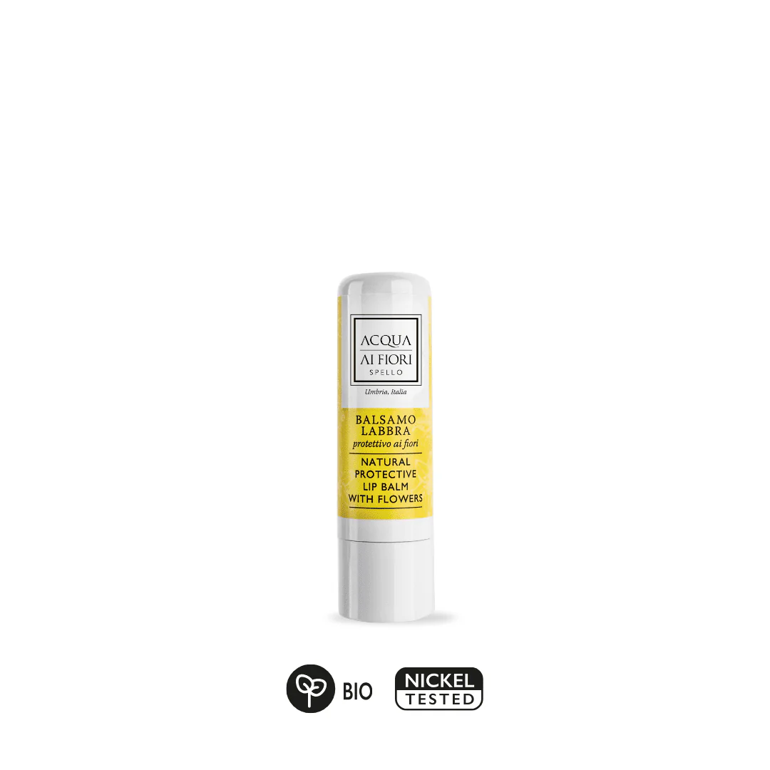 White lip balm tube with a yellow label reading 'Natural Protective Lip Balm with Flowers' and the brand Acqua di Fiori; BIO and Nickel Tested icons shown below.