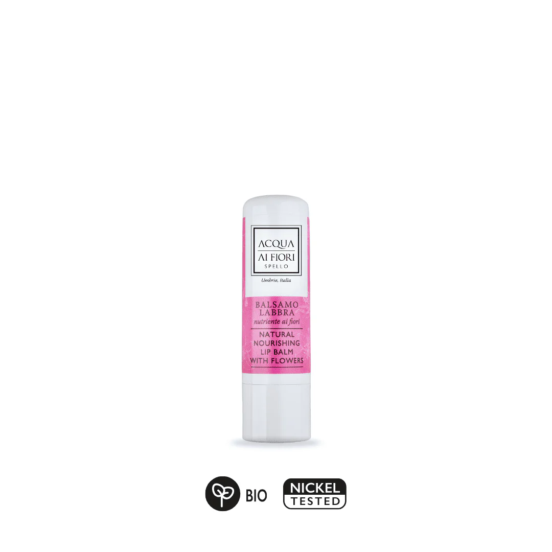 Lip balm stick with pink label, branding 'Acqua ai Fiori' and 'Natural Nourishing Lip Balm with Flowers'