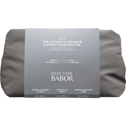 Gray skincare set in a pouch with a silver sleeve reading 'Doctor Babor Best of THD Vitamin C Radiance & Hydro Filler Routine' and listing Refining Cleansing Oil Balm, Hydro Filler Serum, Radiant Complexion Cream.
