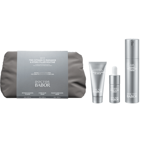 Doctor Babor skincare set with a gray zippered pouch and four silver containers arranged to the right.
