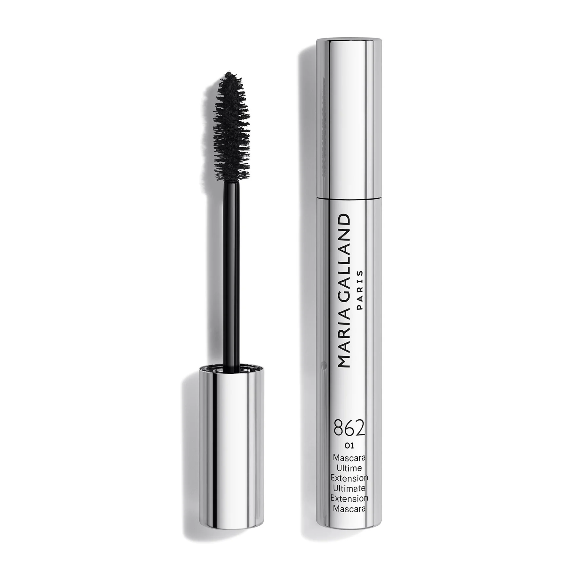 Mascara wand with black bristles beside a tall silver mascara tube with MARC JACOBS PARIS branding