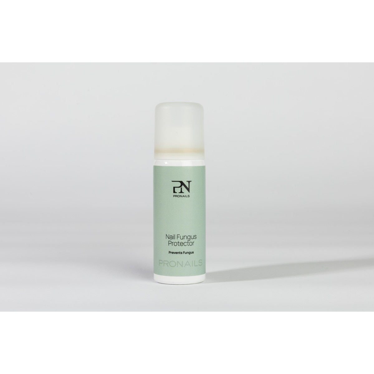 Nail Fungus Protector bottle with a light green label and white cap, Pronails brand, standing on a white surface.